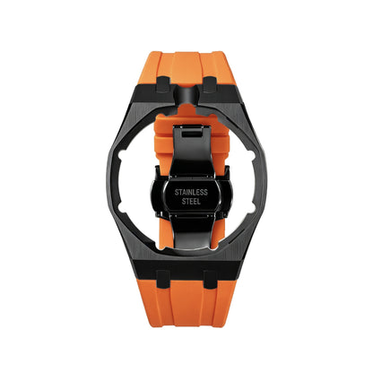 42mm black steel conversion case with orange rubber strap, crown at 12 o'clock