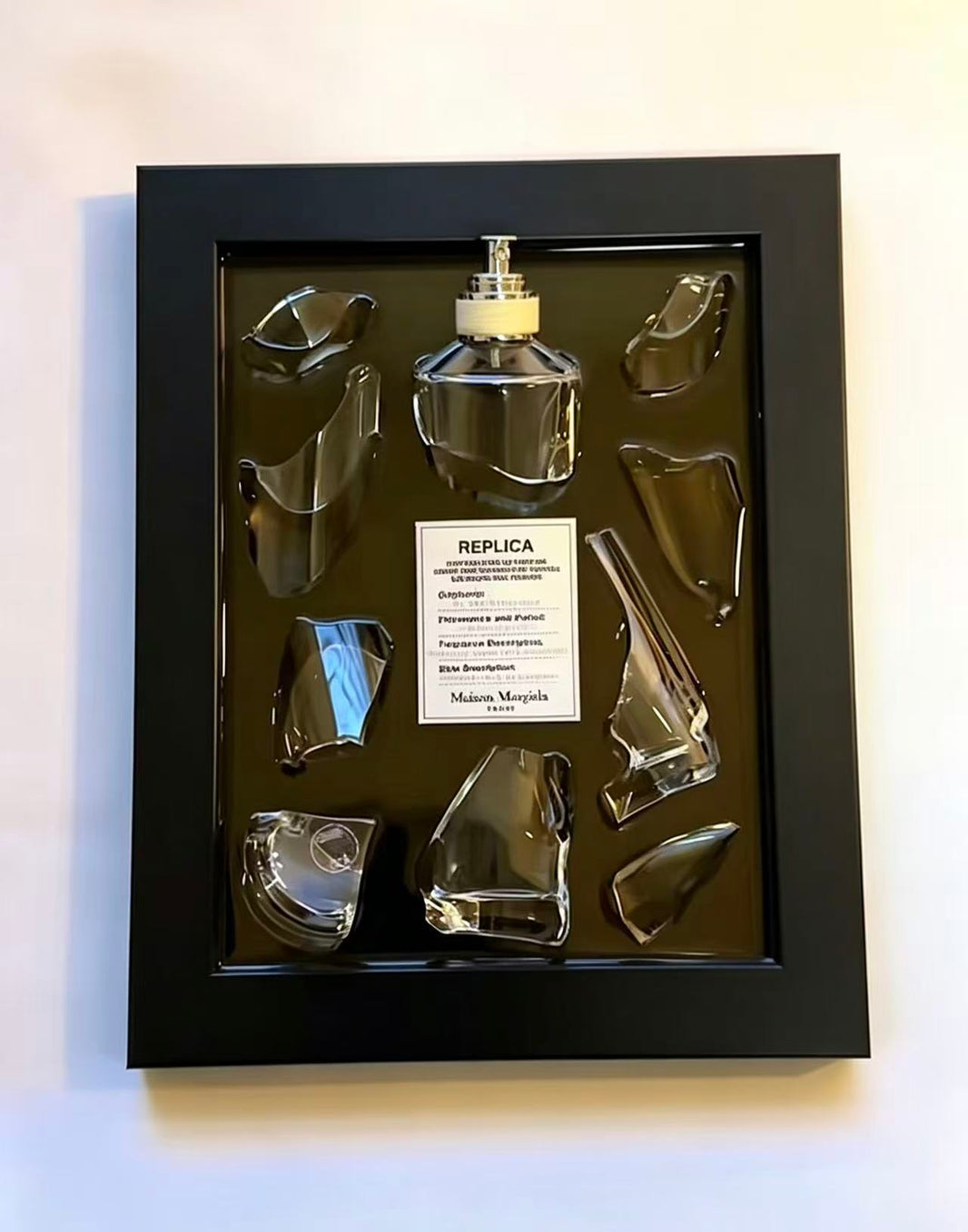 “REPLICA · REPLICA · REPLIC” – Fragmented original perfume glass | Deconstructed opulent mural.