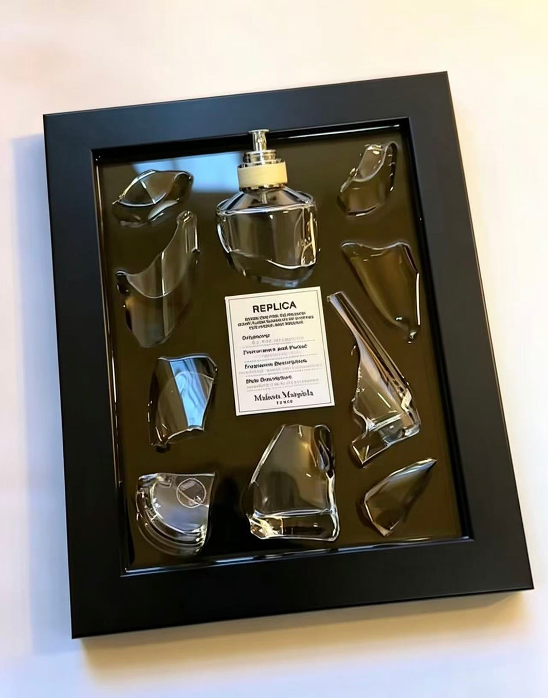 “REPLICA · REPLICA · REPLIC” – Fragmented original perfume glass | Deconstructed opulent mural.