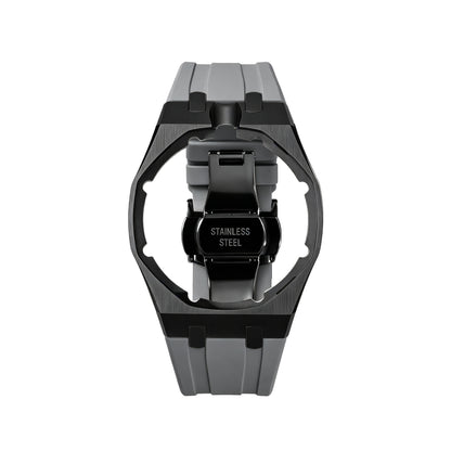 42mm black steel conversion case with grey rubber strap, crown at 12 o'clock